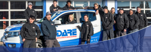 Dare staff standing in front of courtesy shuttle