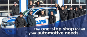 Dare Auto staff standing in front of customer shuttle pick up truck.